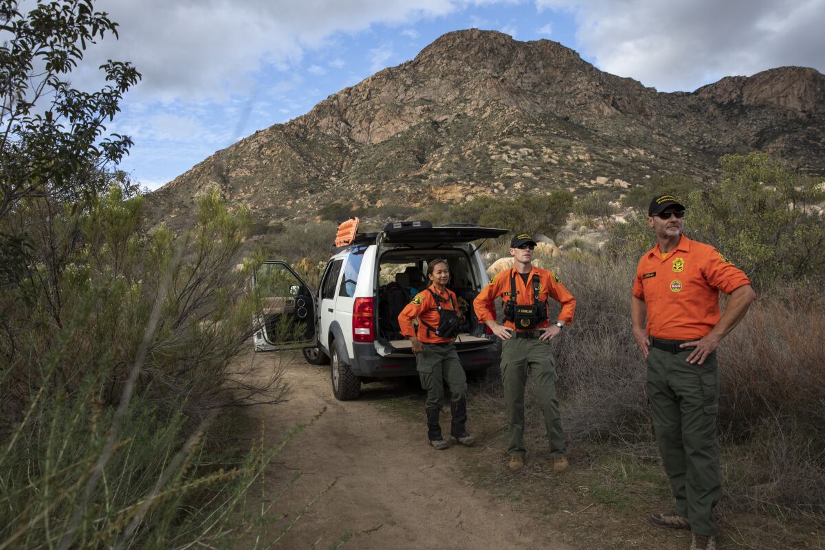 The San Diego County Sheriff's Department Search and Rescue team prepare to leave after recovering the body of a rock climber