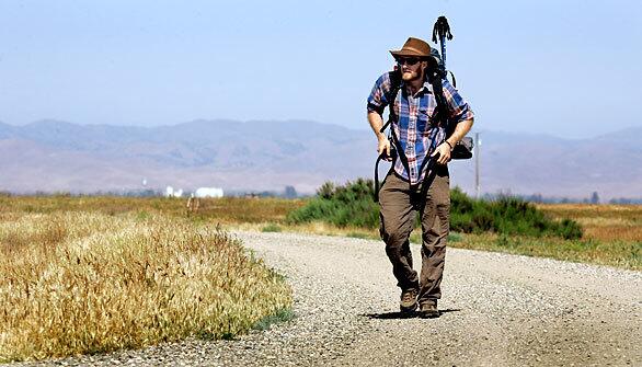 Alex McInturff, a 23-year-old Stanford University graduate student, is retracing conservationist John Muir's 320-mile trek from San Francisco to Yosemite Valley in 1868. Here, McInturff hikes through Kesterson National Wildlife Refuge, part of the larger San Luis National Wildlife Refuge Complex in California's Central Valley.