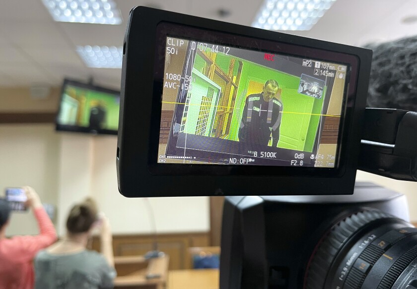 Russian opposition leader Alexei Navalny is seen on the TV camera screen, appears on a video link from prison provided by the Russian Federal Penitentiary Service in a courtroom in Vladimir, Russia, Tuesday, June 28, 2022. A Russian court has rejected an appeal by imprisoned opposition leader Alexei Navalny, who contended that prison authorities illegally prevented his lawyers from bringing necessary equipment including voice recorders and laptop computers to a court session held in a prison. (AP Photo/Kirill Zarubin)