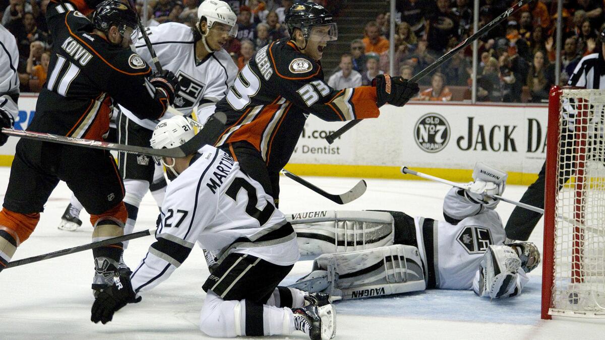 Ducks forward Jakob Silfverberg, center, scores against Los Angeles Kings goalie Jonathan Quick in front of Kings teammates Jordan Nolan, top left, and Alec Martinez during the second period of the Ducks' win in Game 5 of the Western Conference semifinals at Honda Center on Monday.
