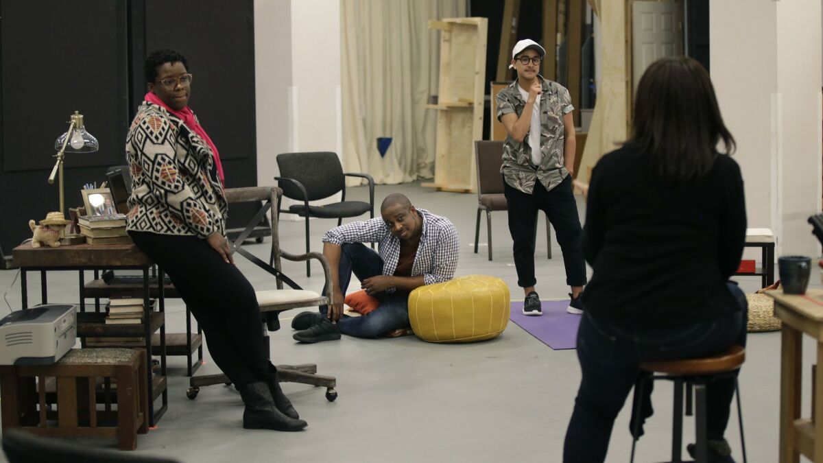 Dorcas Sowunmi, Keith Powell, Avi Roque and Opal Alladin (from left) rehearse a scene from the Old Globe's production of "Tiny Beautiful Things."