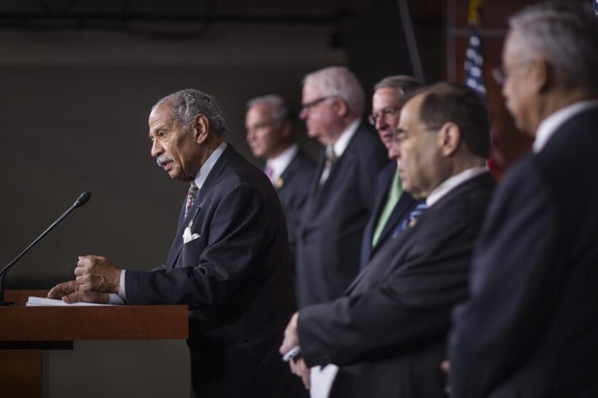 Rep. John Conyers Jr. speaks to the media at the Capitol in Washington on Thursday.