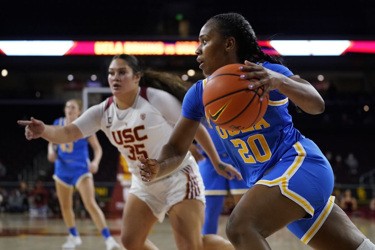 UCLA guard Charisma Osborne drives the ball against USC forward Alissa Pili.