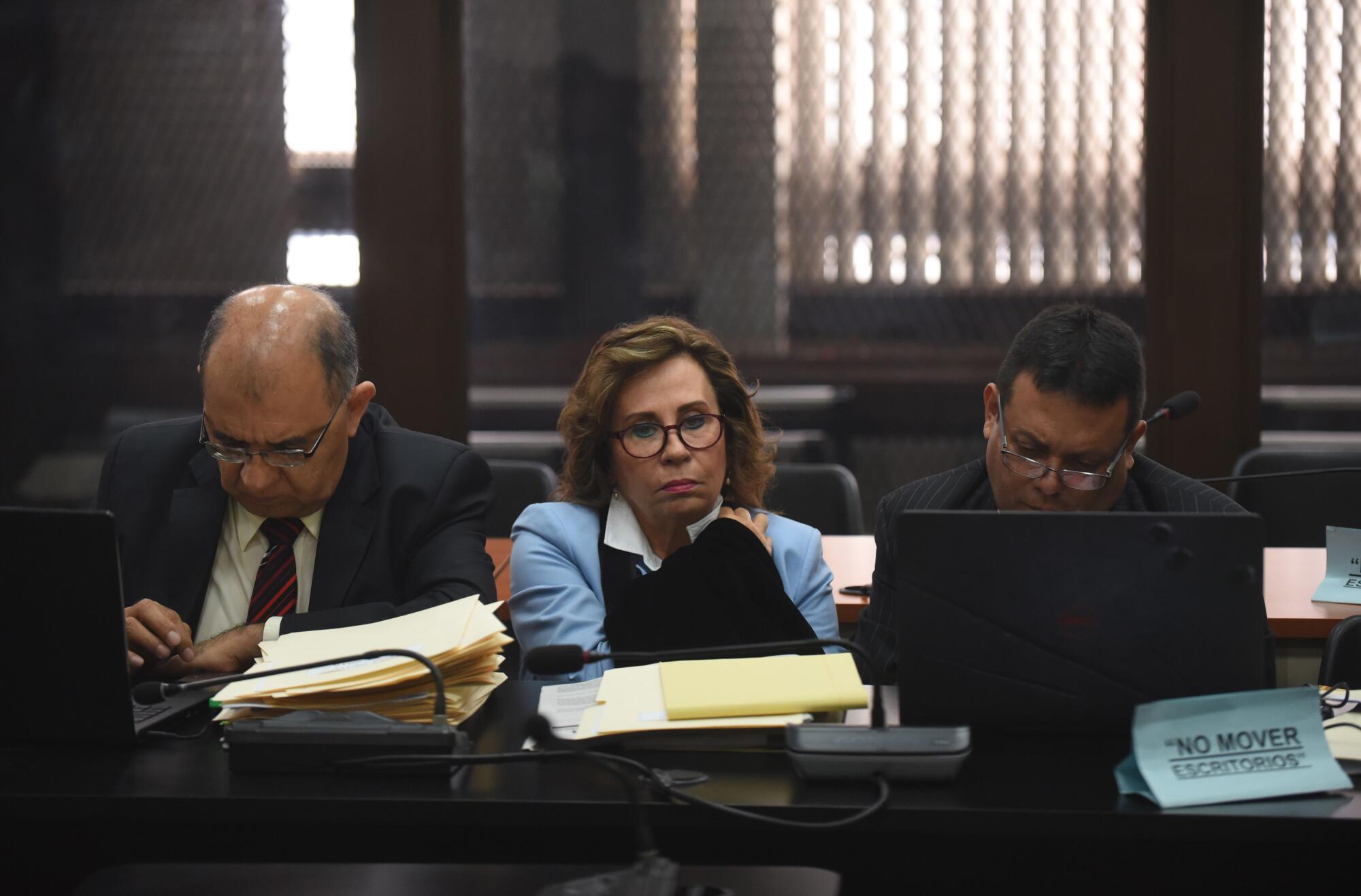 Guatemalan former presidential candidate and former Guatemalan First Lady Sandra Torres (C) attends a hearing