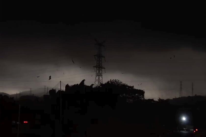 In this image taken from video and released by Douyin@Antique, storm clouds and strong wind are seen over the Baiyun district in the southern Chinese's city of Guangzhou on April 27, 2024. A tornado struck the southern Chinese city of Guangzhou on Saturday, killing some and damaging factory buildings, state media said. (Douyin@Antique via AP)
