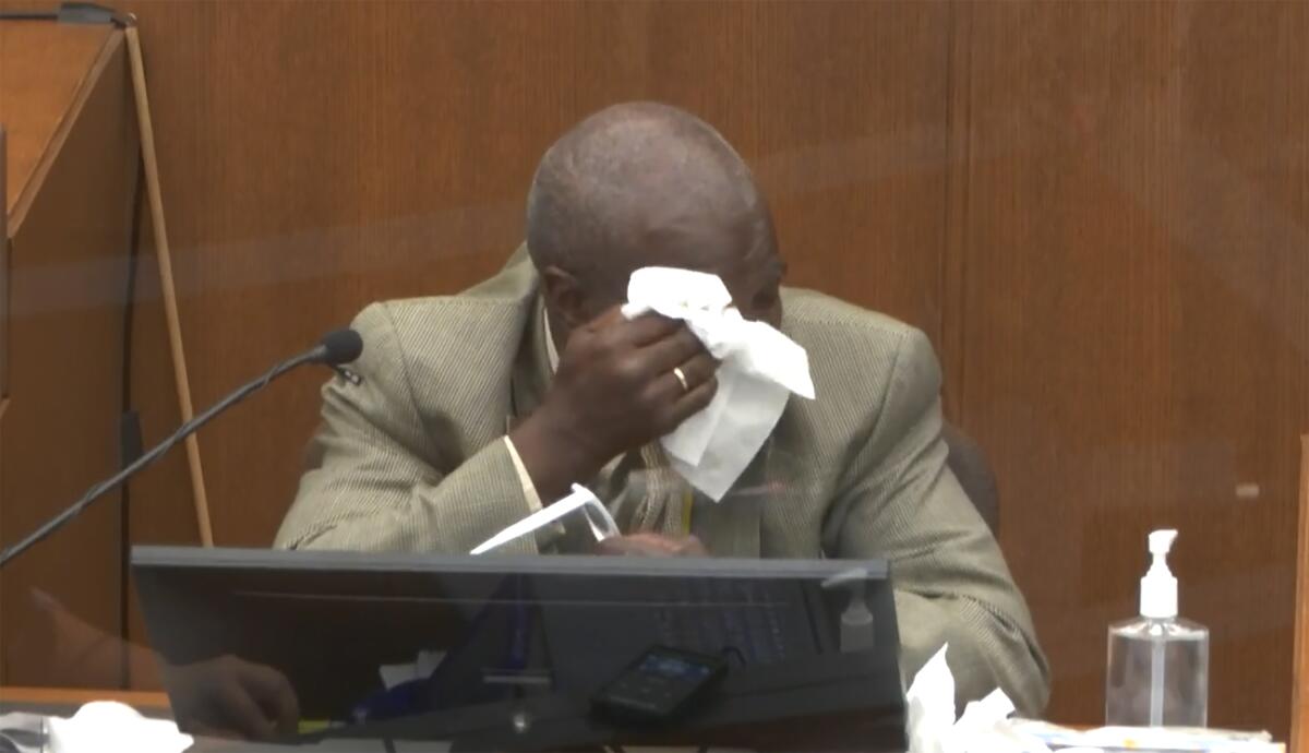 In this image from video, witness Charles McMillian becomes emotional as he answers questions as Hennepin County Judge Peter Cahill presides Wednesday, March 31, 2021, in the trial of former Minneapolis police Officer Derek Chauvin at the Hennepin County Courthouse in Minneapolis, Minn. Chauvin is charged in the May 25, 2020 death of George Floyd. (Court TV via AP, Pool)