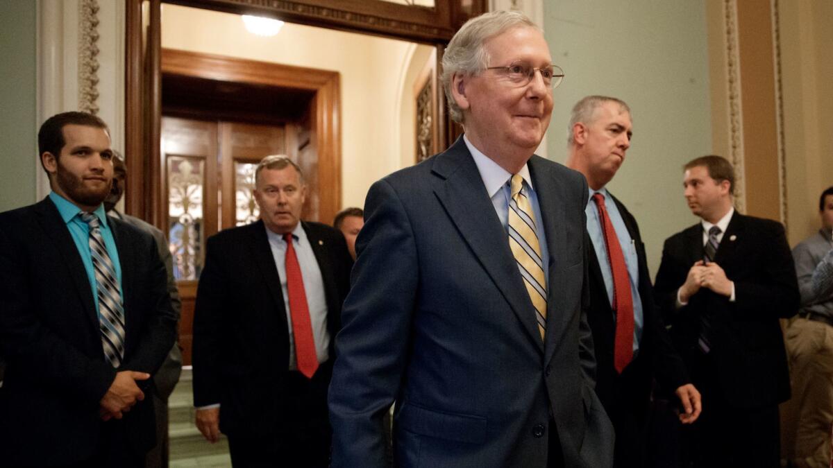 Senate Majority Leader Mitch McConnell leaves the Senate chamber after announcing the revised version of the Republican health care bill in Washington on July 13.