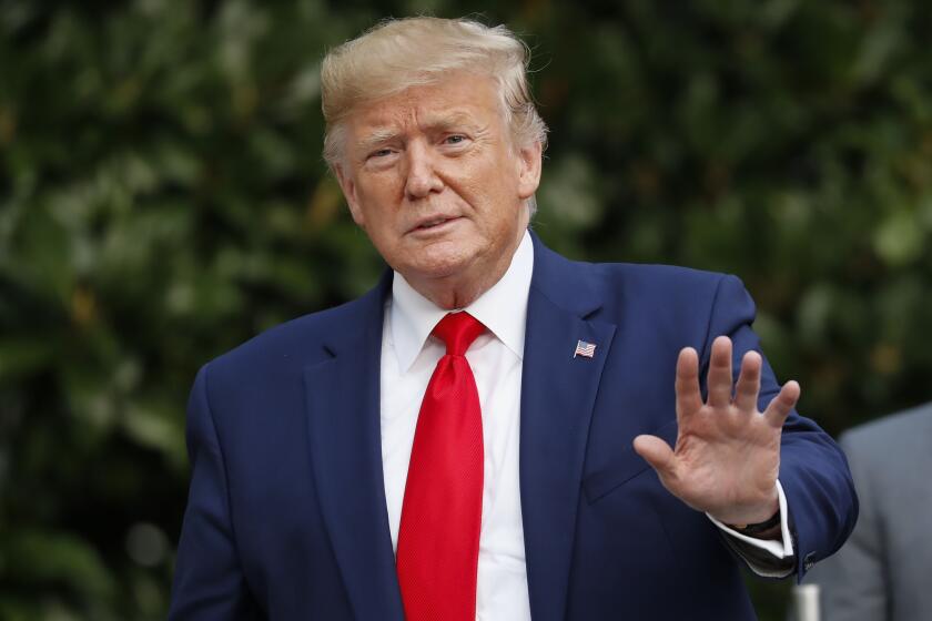 President Donald Trump gestures towards members of the media on the South Lawn of the White House in Washington, Thursday, Oct. 3, 2019, after his return from Florida. (AP Photo/Pablo Martinez Monsivais)