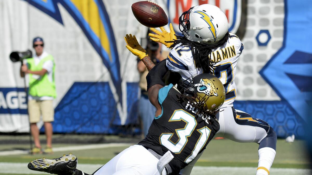 Chargers receiver Travis Benjamin makes a touchdown catch against Jaguars cornerback Davon House in the second half.