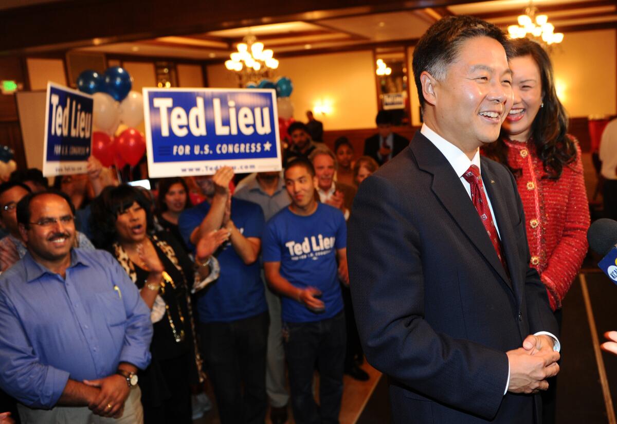 State Sen. Ted Lieu (D-Torrance),joined by his wife, Betty, greets supporters Tuesday night after winning a spot on fall ballot in the race to succeed U.S. Rep. Henry A. Waxman.