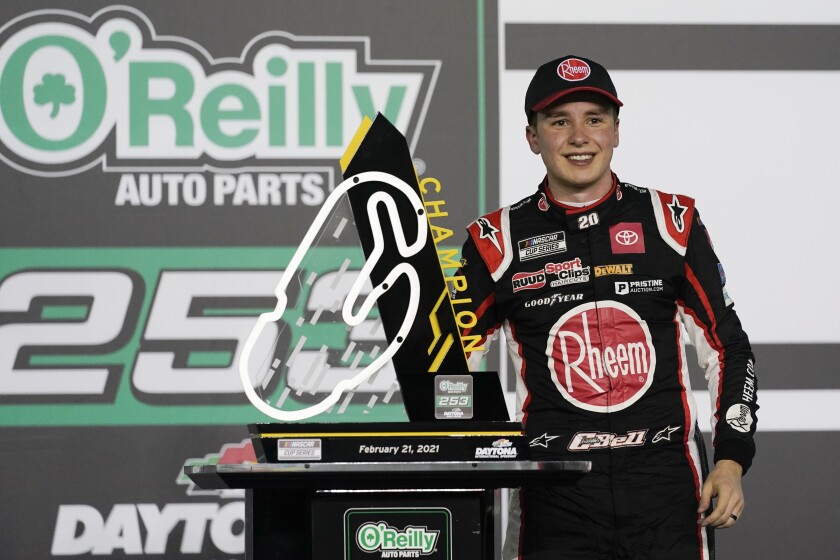 Christopher Bell celebrates in Victory Lane after winning the NASCAR Cup Series road course.