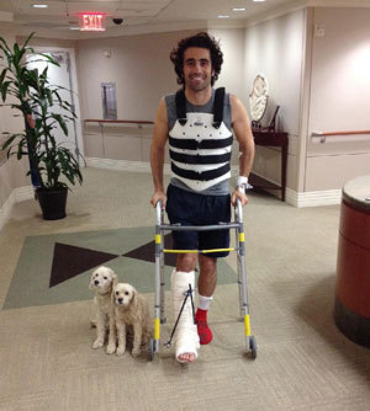 Dario Franchitti poses with his dogs, Shug and Buttermilk, in a photo taken by his brother, Marino Franchitti, at Memorial Hermann-Texas Medical Center in Houston on Oct. 10.