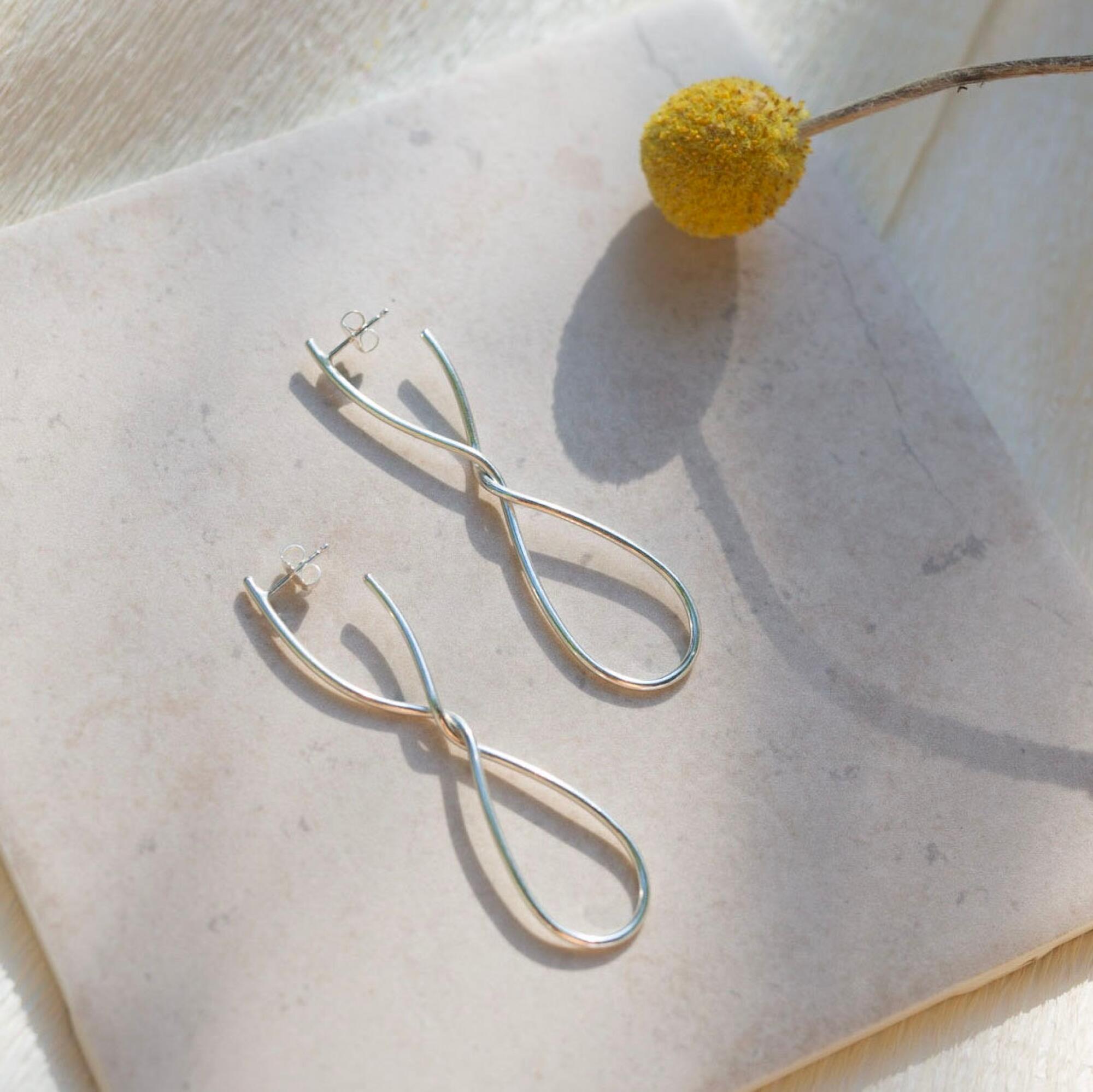 Laura Estrada Bruna petit earrings, $130 Handcrafted in L.A., these elegant earrings are like a sterling silver dance.