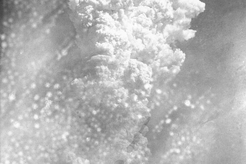 FILE - In this Aug. 6, 1945, file photo, smoke rises 20,000 feet above Hiroshima, western Japan, after the first atomic bomb was dropped during warfare. Hiroshima was targeted because it was a major Japanese military hub filled with military bases and ammunition facilities. The city of Hiroshima on Thursday, Aug. 6, 2020 marks the 75th anniversary of the world’s first nuclear attack. (AP Photo, File)