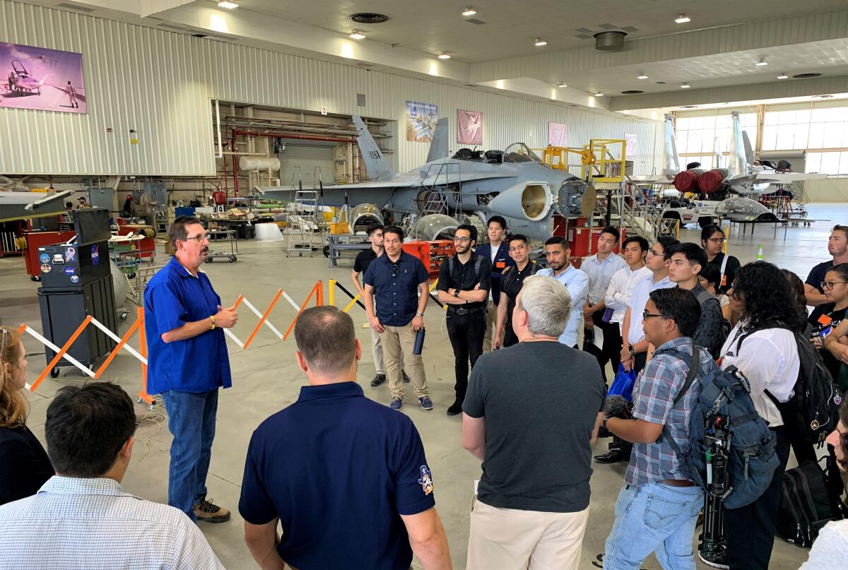OCC students speak with a NASA employee on an August 2019 trip to the Neil A. Armstrong Flight Research Center.