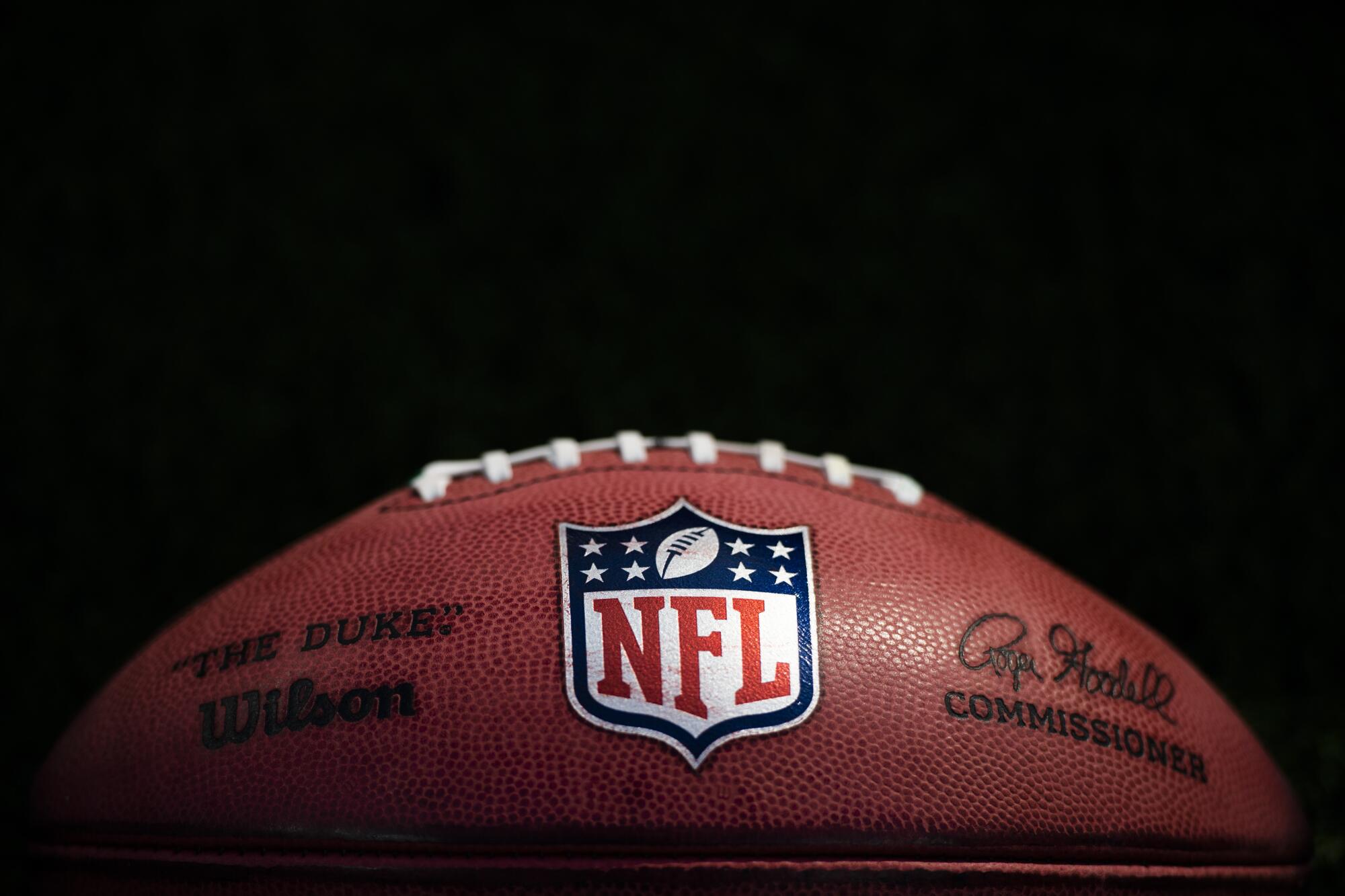 A detail of National Football League ball is seen before an NFL football ga