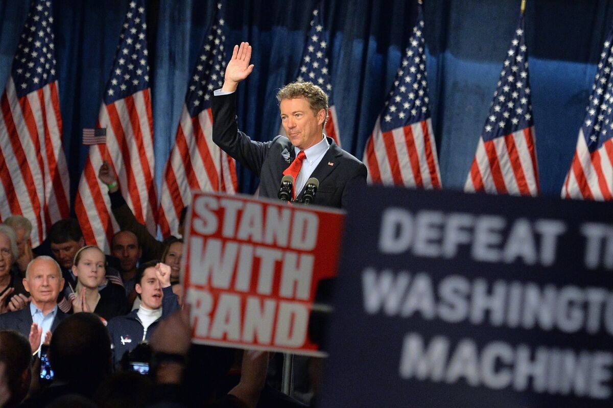 Sen. Rand Paul of Kentucky waves to the crowd of supporters during the kickoff of his presidential campaign April 7.