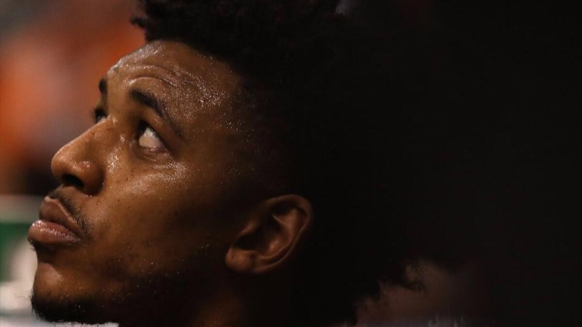 Lakers guard Nick Young (0) watches from the bench during the second half of a game against the Phoenix Suns on Feb. 15.
