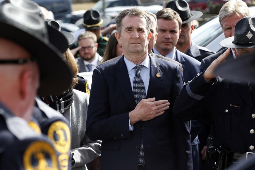 CHILHOWIE, VIRGINIA - FEBRUARY 09: Virginia Gov. Ralph Northam watches as the casket of fallen Virginia State Trooper Lucas B. Dowell is carried to a waiting tactical vehicle during the funeral at the Chilhowie Christian Church on February 9, 2019 in Chilhowie, Virginia. (Photo by Steve Helber - Pool/Getty Images) ***BESTPIX*** ** OUTS - ELSENT, FPG, CM - OUTS * NM, PH, VA if sourced by CT, LA or MoD **