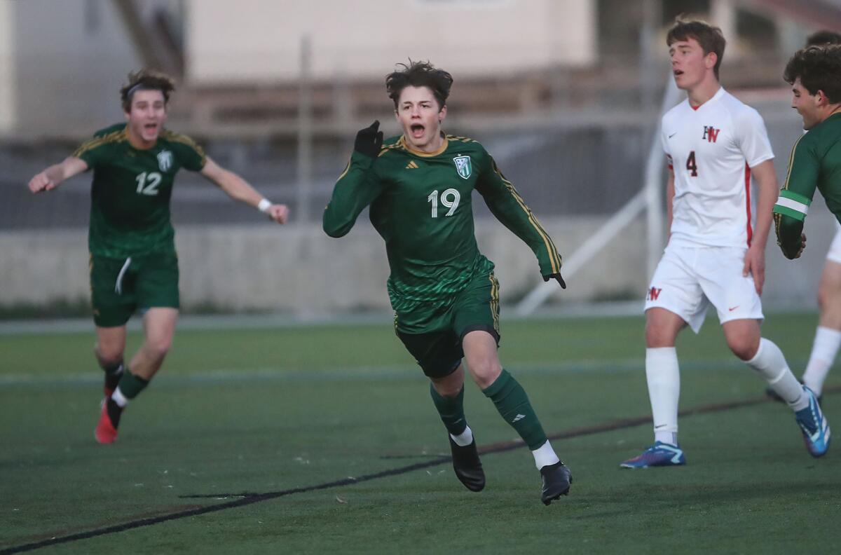 Edison's Luca Petruolo (19) celebrates a goal to the dismay of Harvard-Westlake's James Federman (4) on Friday.