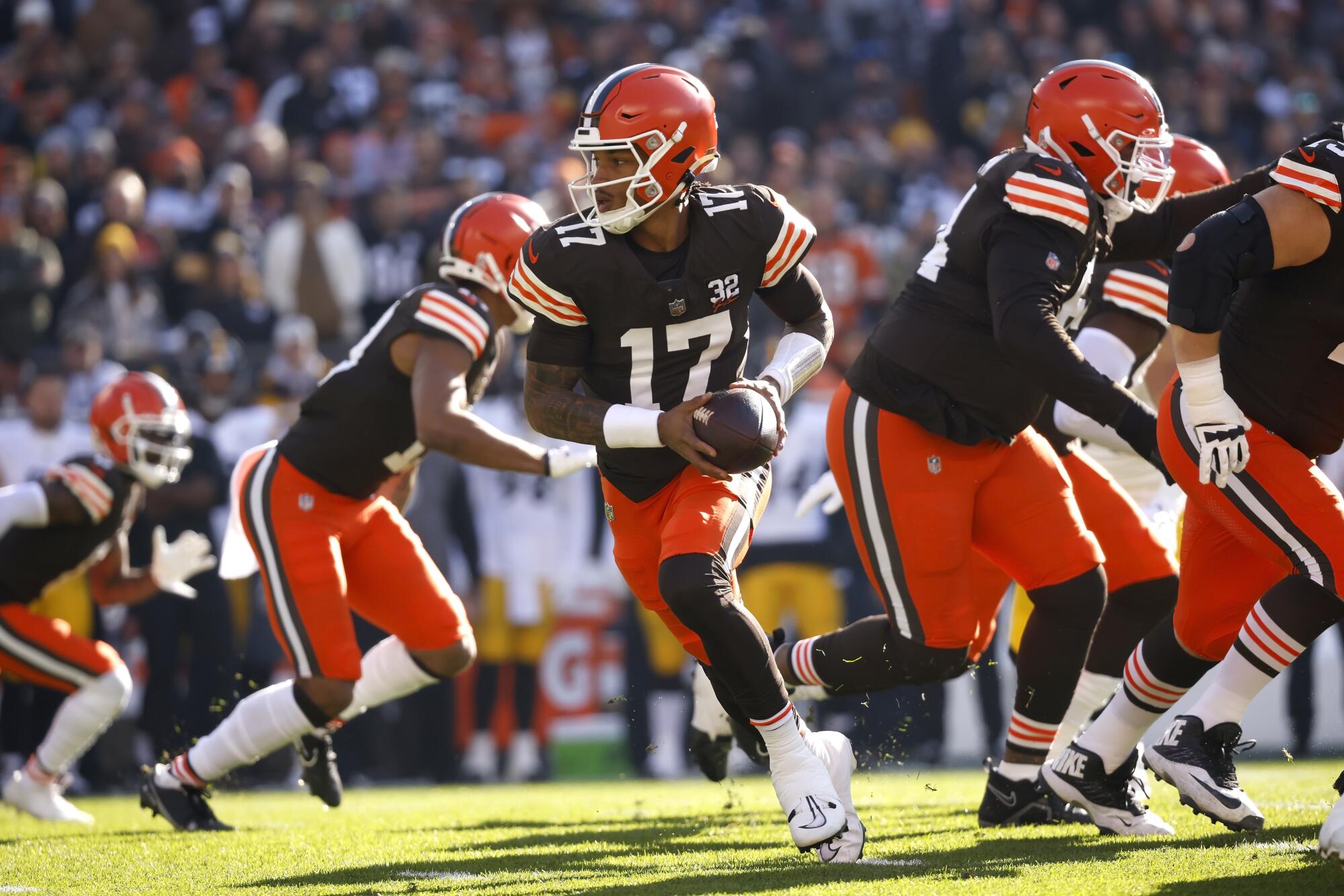 Browns quarterback Dorian Thompson-Robinson looks to hand off the ball during a game against the Steelers on Nov. 19.