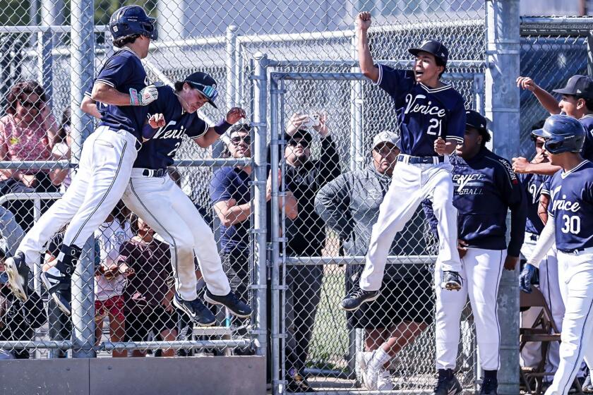 Venice's Canon King (left) gives a chest bump after his home run against Chatsworth.