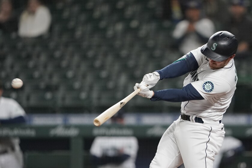 Seattle Mariners' Kyle Seager hits a sacrifice fly to score Sam Haggerty in the eighth inning of a baseball game against the Baltimore Orioles, Tuesday, May 4, 2021, in Seattle. (AP Photo/Ted S. Warren)