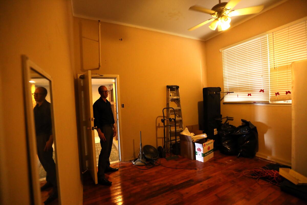 Bob Daignault, director of marketing with the Apartment Association of Greater Los Angeles, looks over a vacant illegal "bootlegged" apartment unit in Los Angeles on June 24.