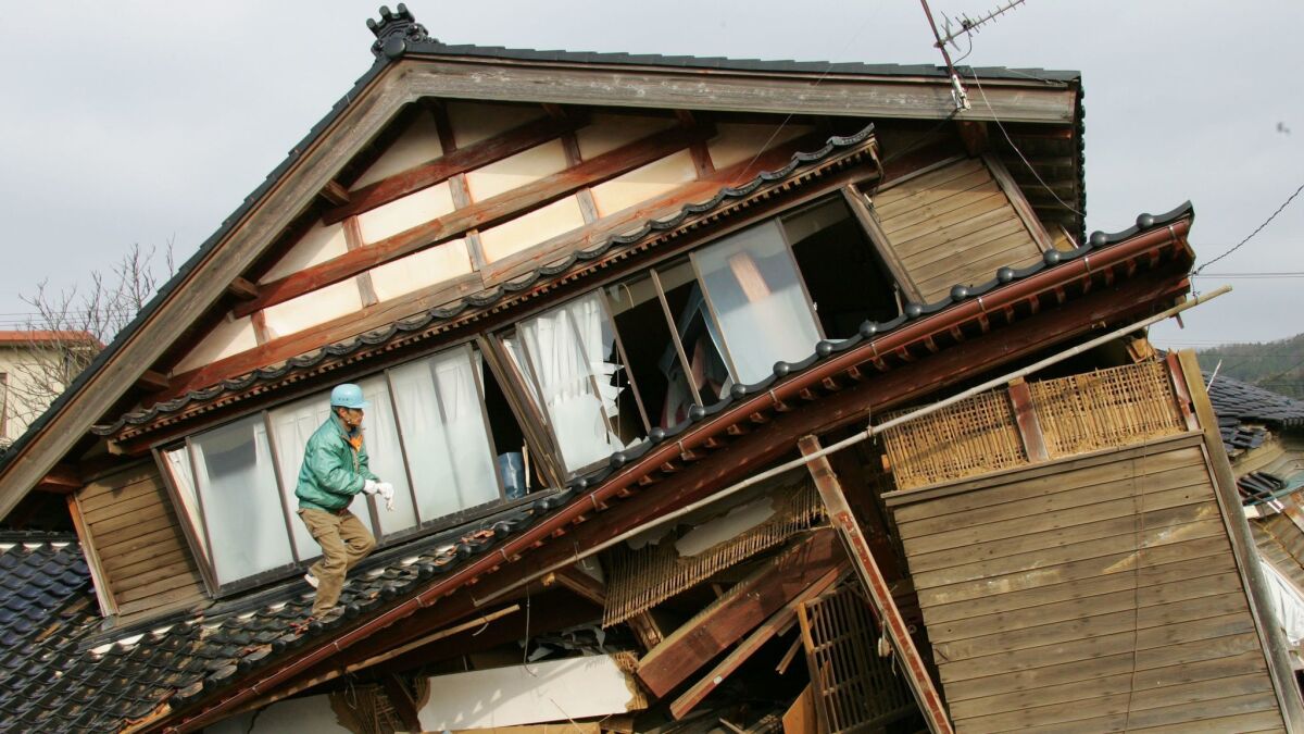 A collapsed house after an earthquake in Japan in 2007.
