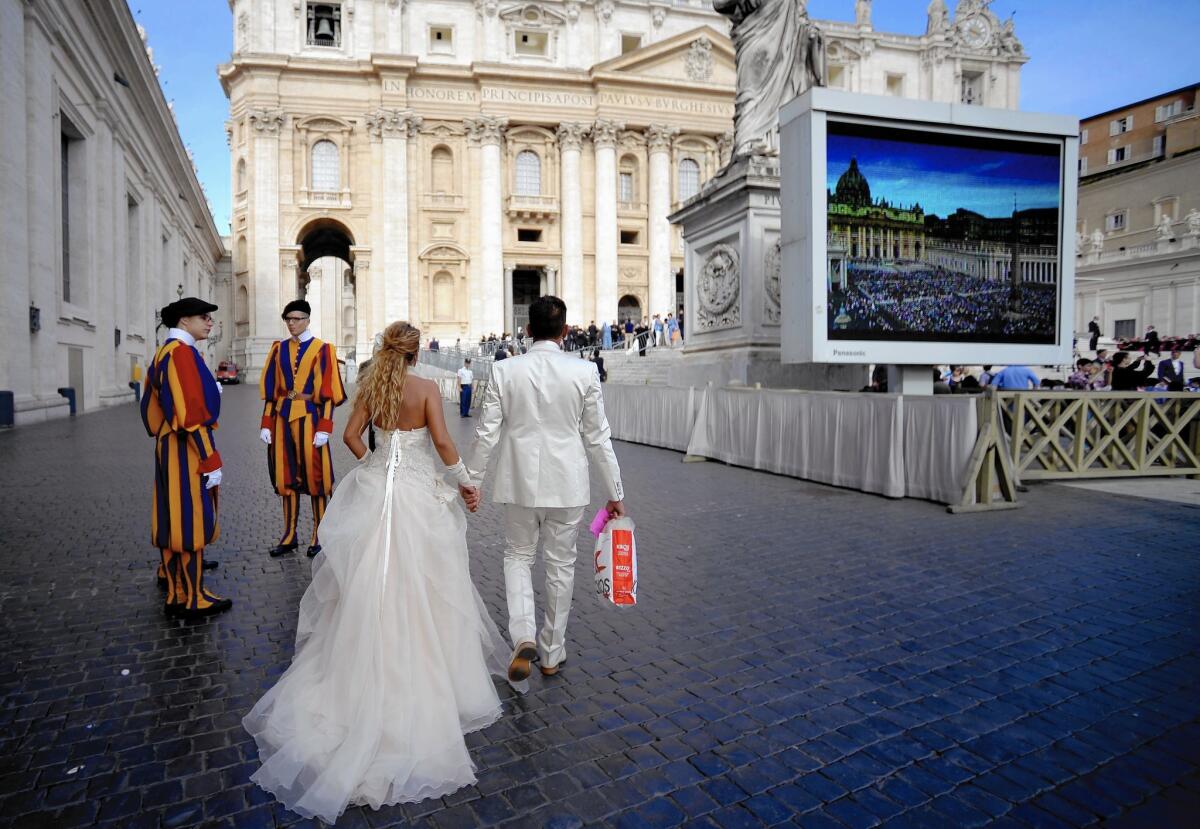 A bride and groom arrive at the Vatican for Pope Francis' weekly general audience. The pontiff is changing the way the church handles annulments.