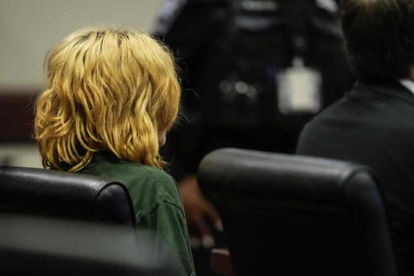 Colt Gray, charged as an adult with four counts of murder, sits in the Barrow County courthouse during his first appearance for the Wednesday shooting at Apalachee High School, Friday, Sept. 6, 2024, in Winder, Ga. (AP Photo/Brynn Anderson, Pool)