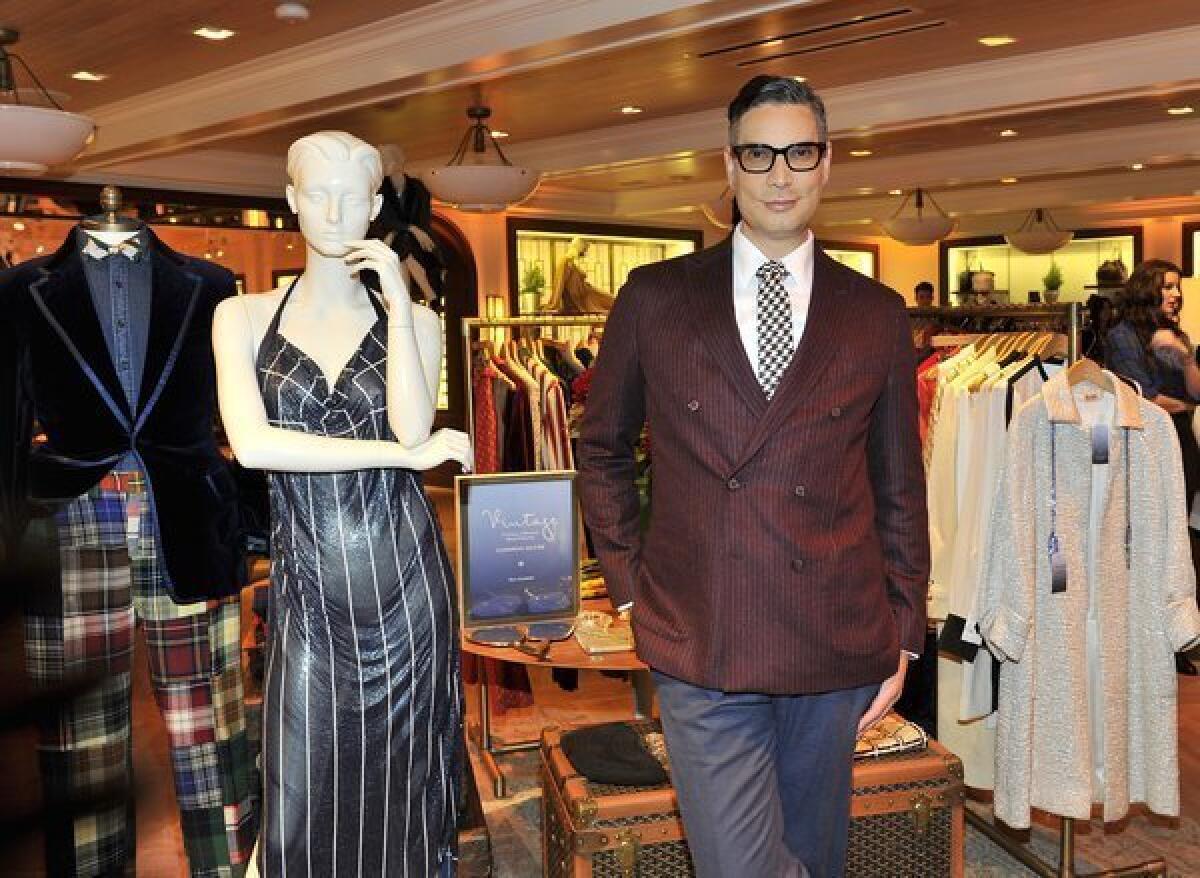 Cameron Silver alongside some of the pieces in the Cameron Silver Vintage Capsule Collection for Tommy Hilfiger, which will be sold exclusively at the Robertson Boulevard Tommy Hilfiger boutique this holiday season.