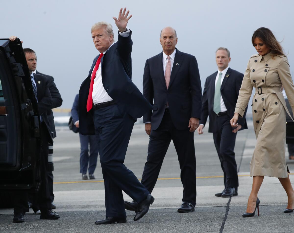 President Trump walks with Gordon Sondland, center, and First Lady Melania Trump in Brussels in 2018.

