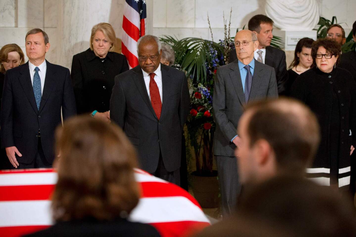 Ferom left; Supreme Court Chief Justice John G. Roberts, Jr.,; Ginny Thomas, Justice Clarence Thomas, Justice Stephen G. Breyer, and Justice Sonia Sotomayor attend a private ceremony in the Great Hall of the Supreme Court where late Supreme Court Justice Antonin Scalia lies in repose in Washington, DC.