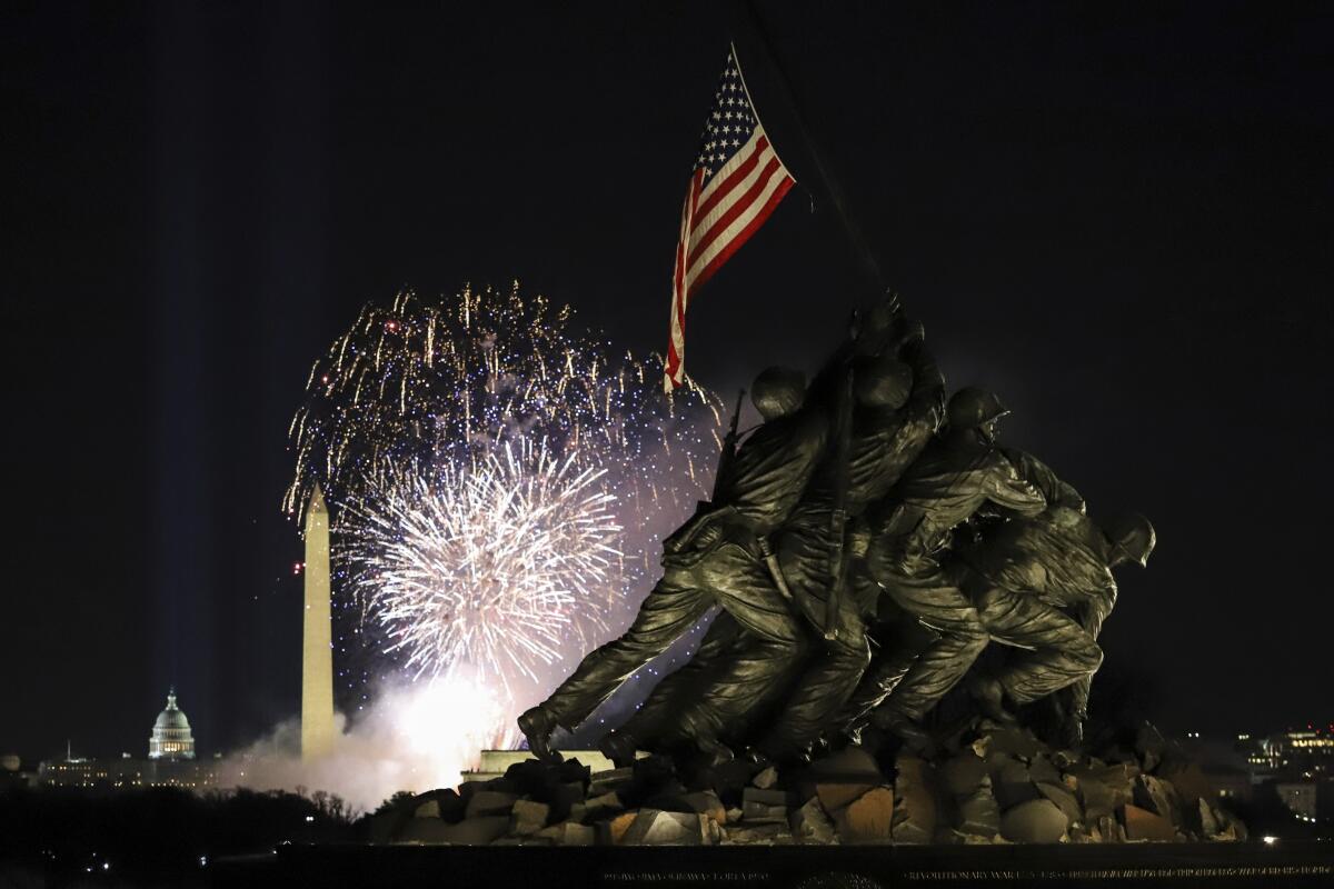 Fireworks explode over the Washington Monument as part of festivities after President Biden's inauguration.