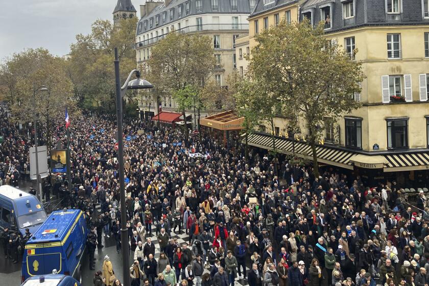 Thousands gather for a march against antisemitism in Paris, France, Sunday, Nov. 12, 2023. French authorities have registered more than 1,000 acts against Jews around the country in a month since the conflict in the Middle East began. (AP Photo/Sylvie Corbet)