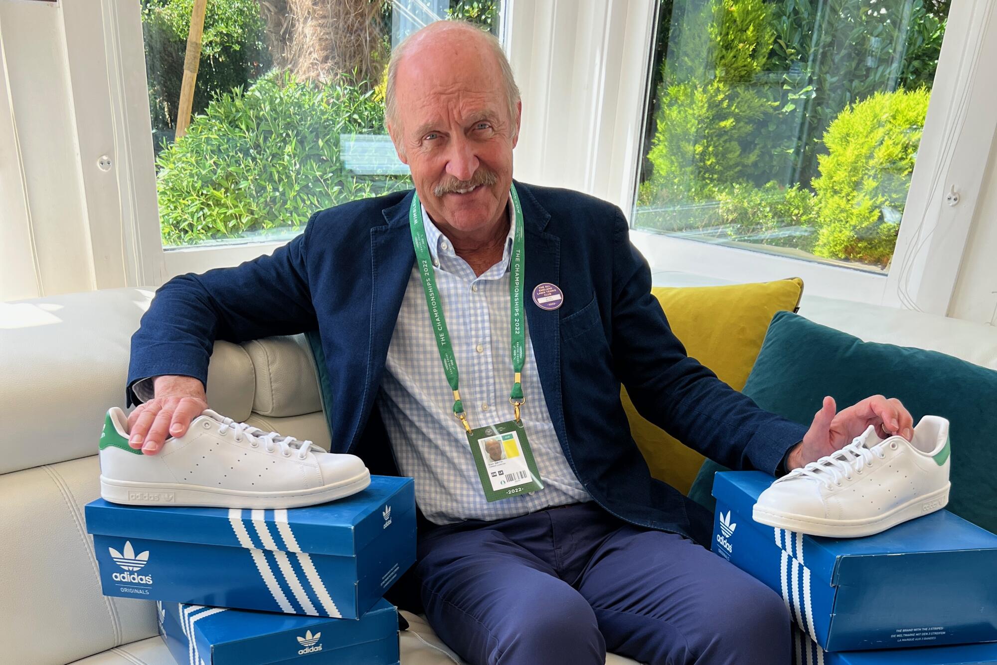 Tennis great Stan Smith at home with his namesake Adidas shoe.