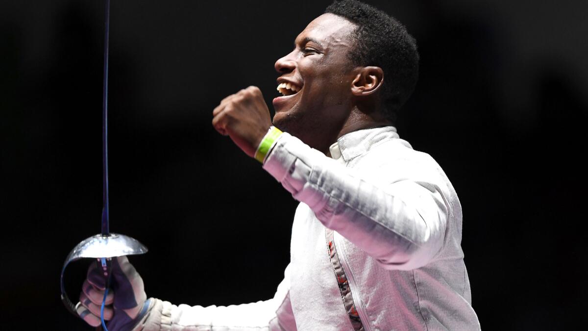 American fencer Daryl Homer celebrates after winning his semifinal in men's individual saber on Wednesday. He lost in the final to Hungary's Aron Szilagyi.