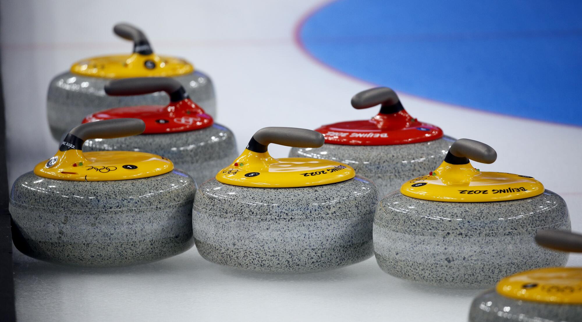 Curling stones on ice