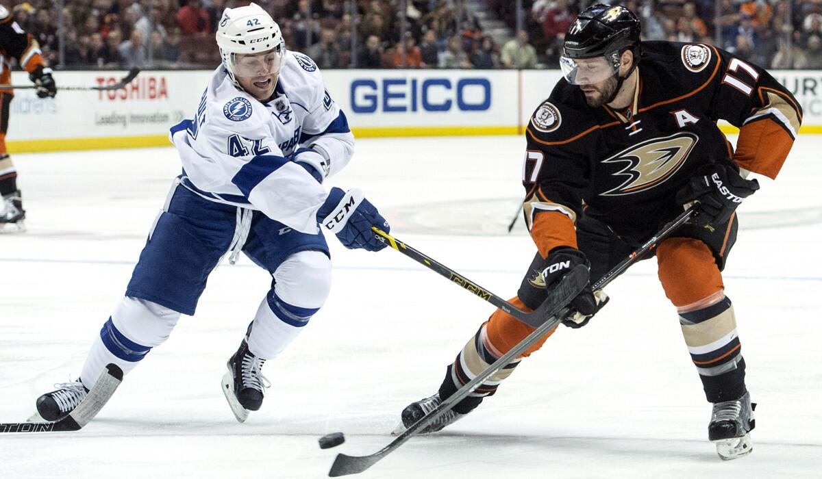 Anaheim Ducks' Ryan Kesler, right, controls the puck away from the Tampa Bay Lightning's Jonathan Marchessault during a game on Wednesday.
