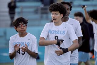 Senior forward Anthony Villa, center, scored both goals for El Camino Real in its 2-1 overtime victory against Palisades in the City Section Division I quarterfinals.