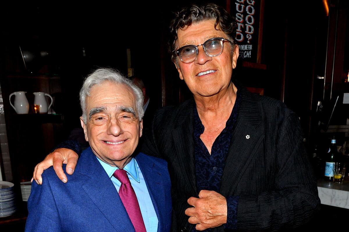 Robbie Robertson hugs Martin Scorsese in 2019.
