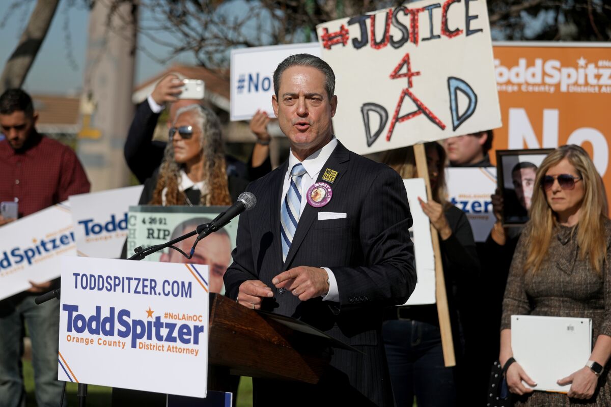 Orange County D.A. Todd Spitzer speaks at outdoor news conference.
