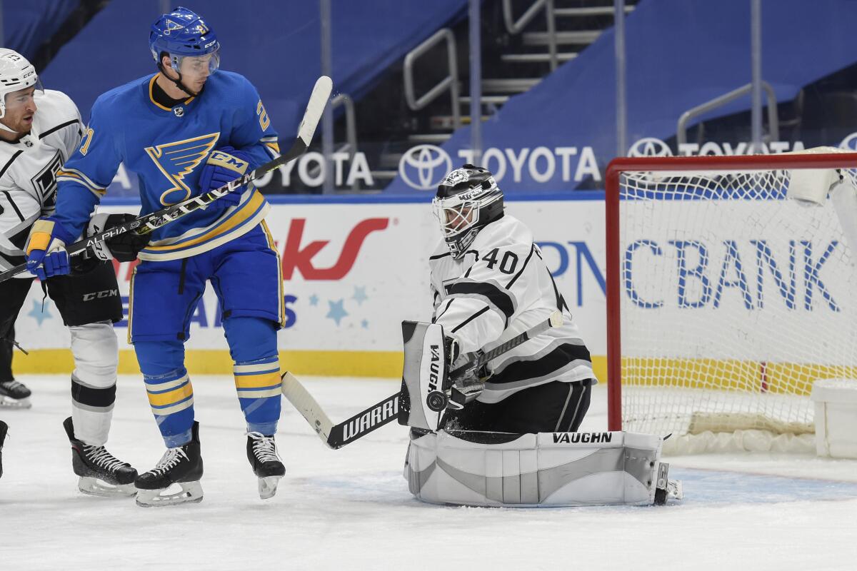 Kings backup goalie Cal Petersen defends the net against the St. Louis Blues' Tyler Bozak (21) during the third period.