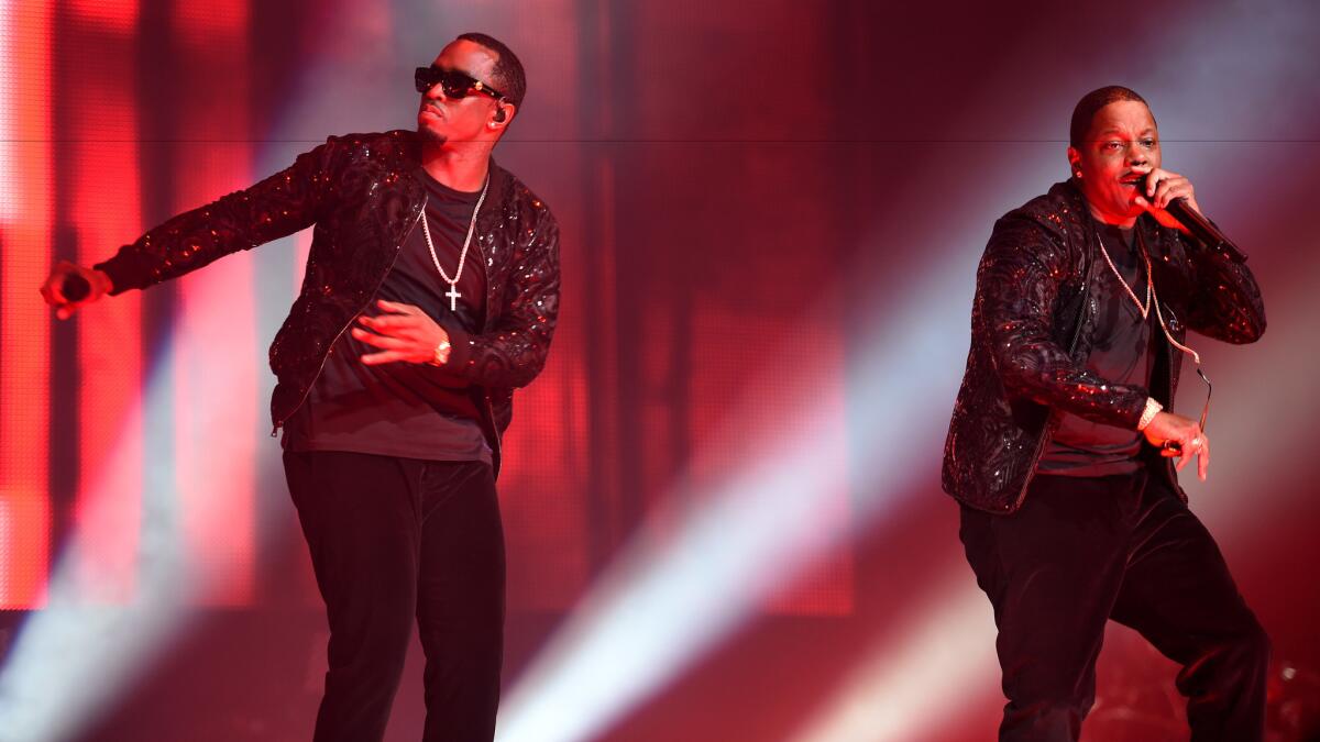 Mase, right, and Puff Daddy onstage for the Puff Daddy and Bad Boy Family Reunion Tour on Sunday at Madison Square Garden in New York.
