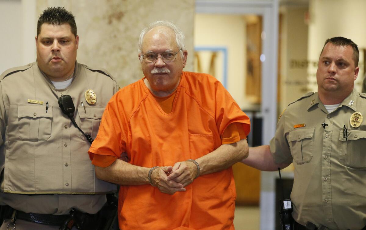 Robert Bates, a former Oklahoma volunteer sheriff's deputy, is escorted from the courtroom after his sentencing Tuesday.