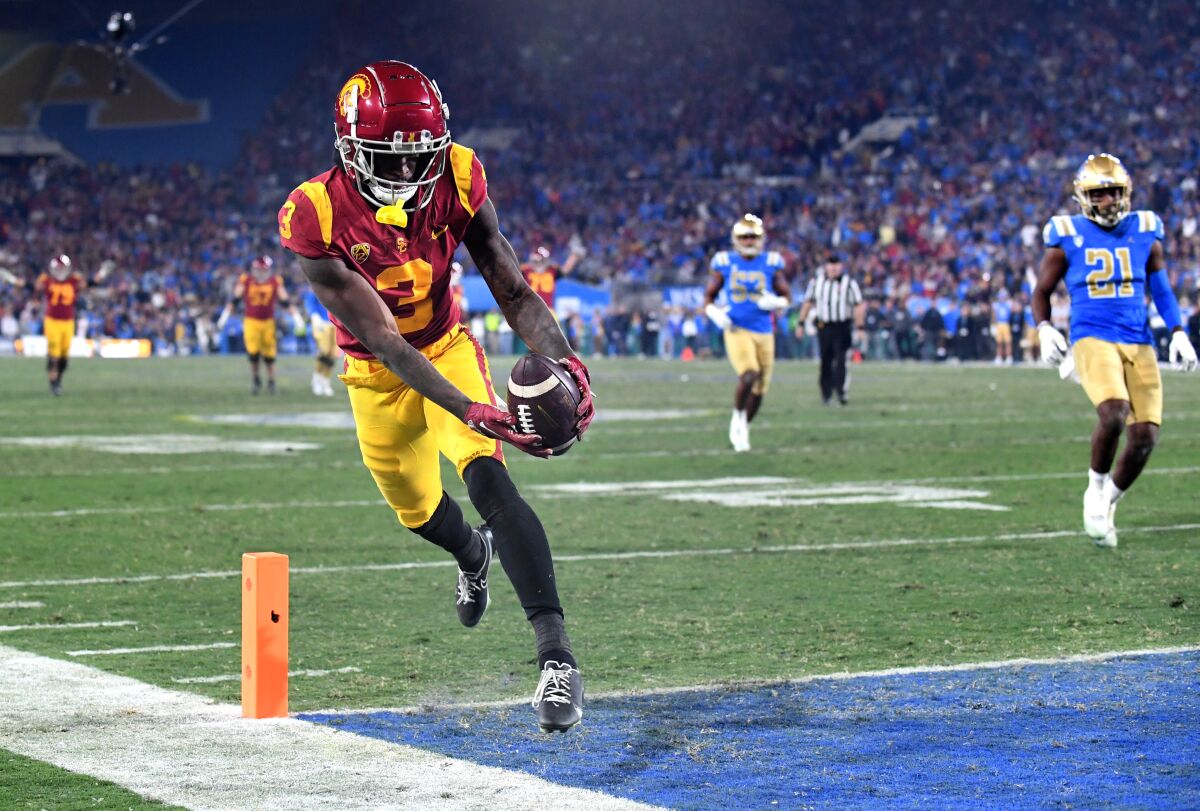 USC wide receiver Jordan Addison scores with a touchdown pass against UCLA on November 19.
