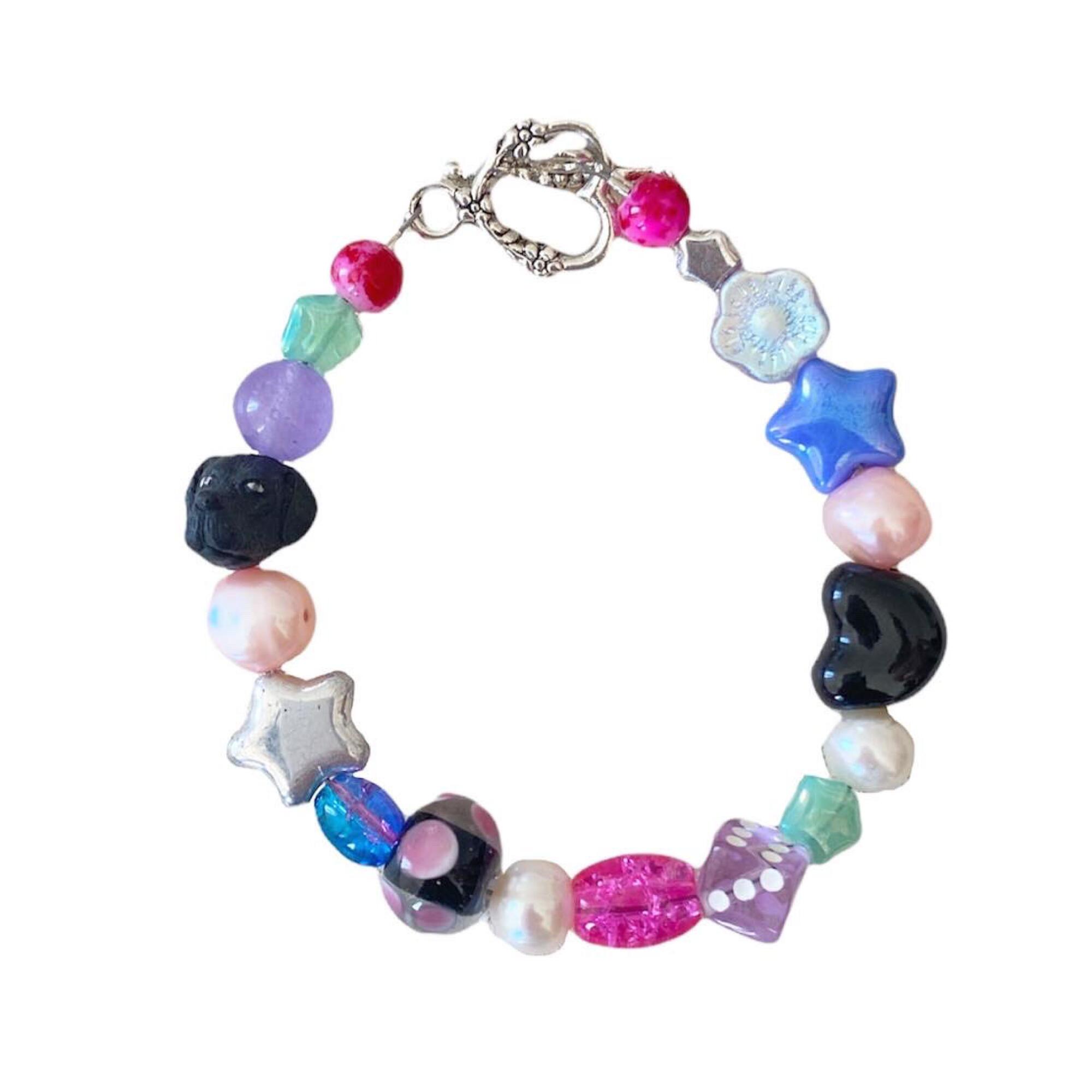 A bracelet made of colorful beads and charms.