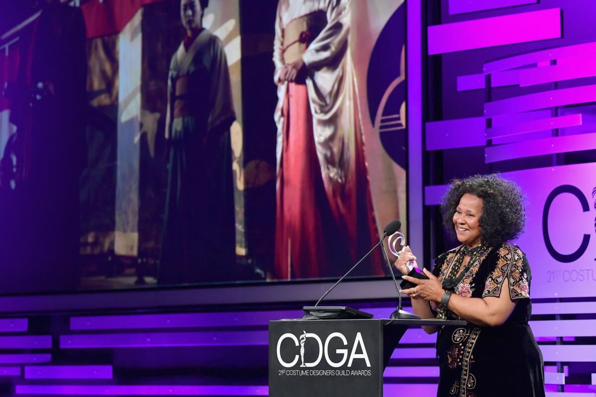 Sharen Davis accepts the award for sci-fi/fantasy television for "Westworld" at the 21st Costume Designers Guild Awards.