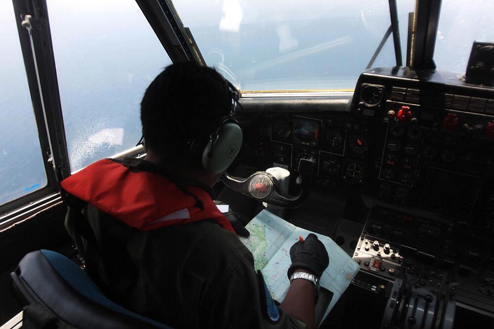 An Indonesian Navy pilot conducts an aerial search for the missing Malaysia Airlines flight MH370 in the waters bordering Indonesia, Malaysia and Thailand on March 10.